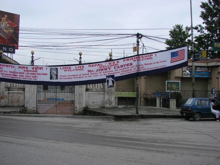 banner strung in the air on an old town street