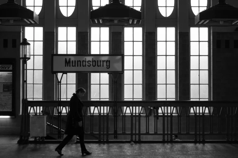 a person is walking near a train station