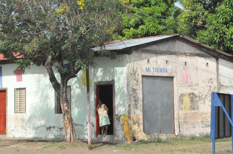 a building with a person opening a door to it