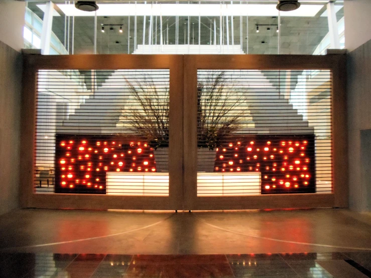 the view of an open window with red light bulbs