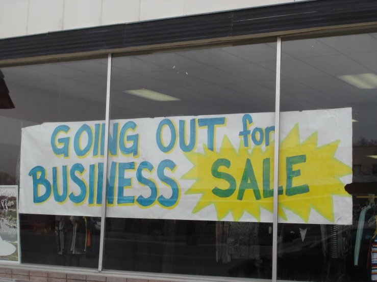 a sign is posted inside a store window