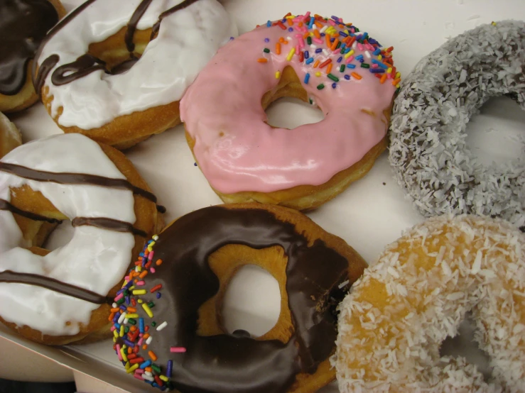 this box has an assortment of different types of donuts