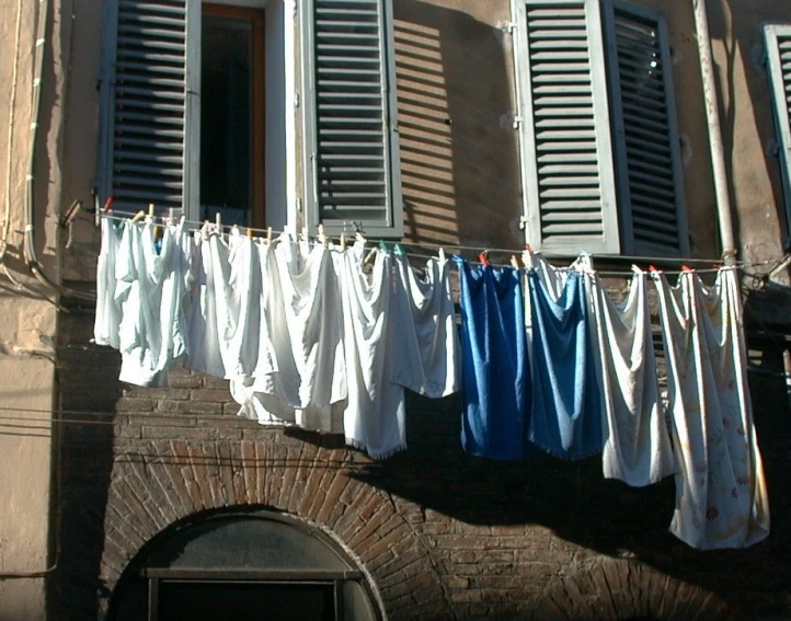 a large building with white cloth hung outside it