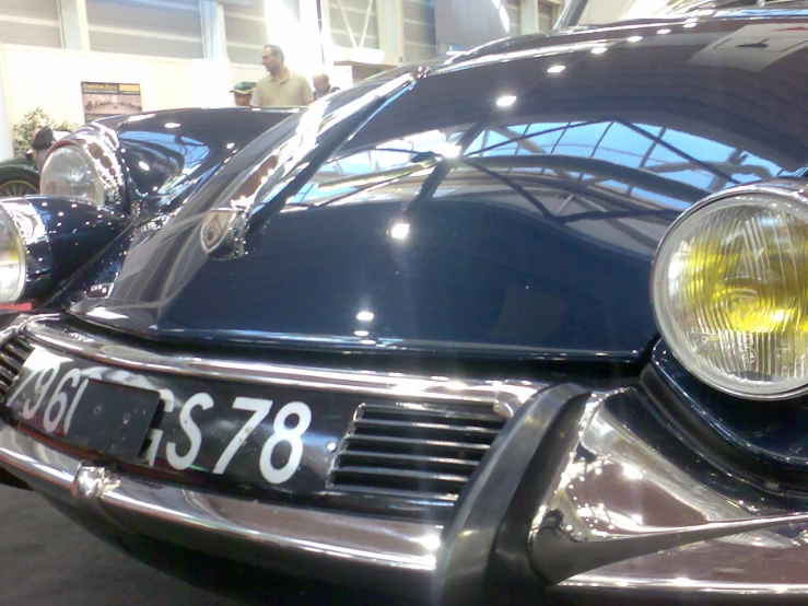 a close up of the headlight and headlights on a classic car