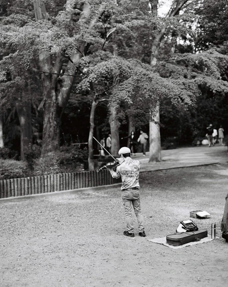 a black and white po of someone in a park
