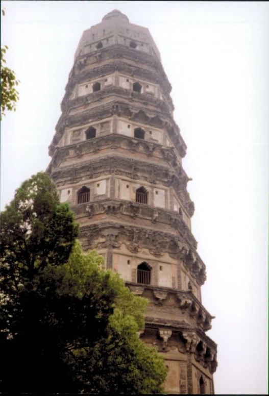 an old tower with several openings in the roof