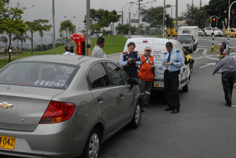 police on the street with a group of men in uniform