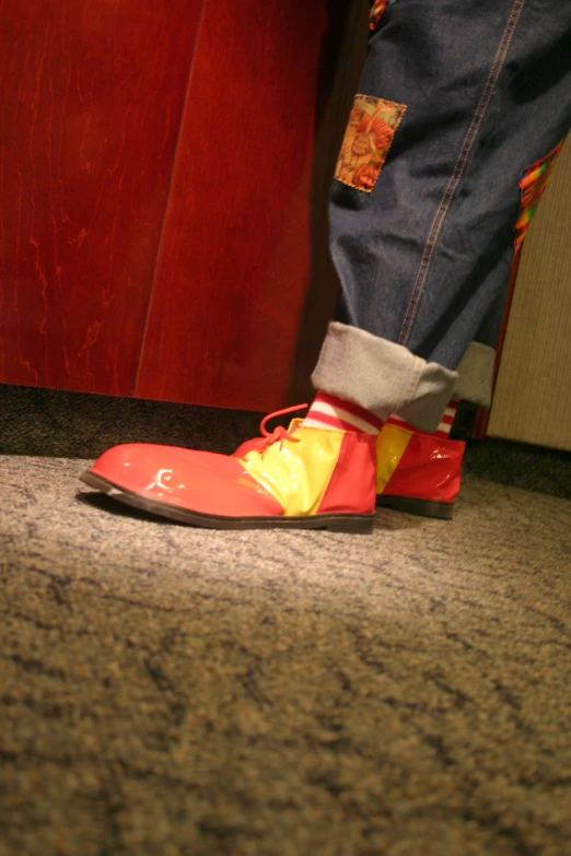 a shoe is being worn near a persons feet