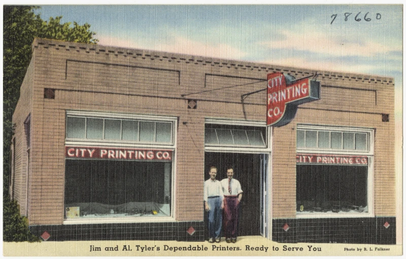 an antique picture of two men standing in the doorway of a business