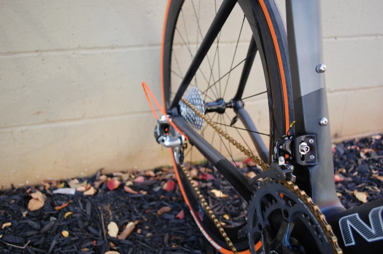 the gears of a bicycle are showing up on a sidewalk