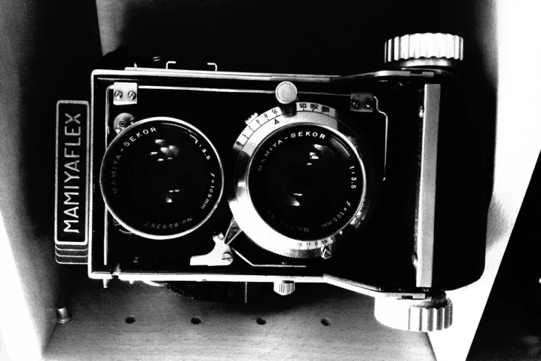 a black and white po of a miniature camera