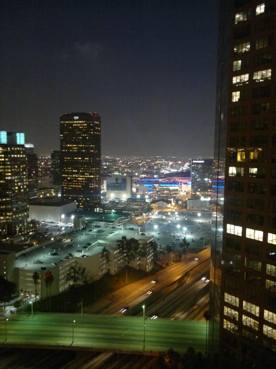 the city skyline at night from a tall skyscr