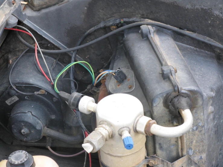 the inside of an old dirty car with two gauges