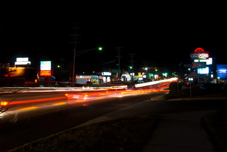 blurry pograph of car lights on the street at night