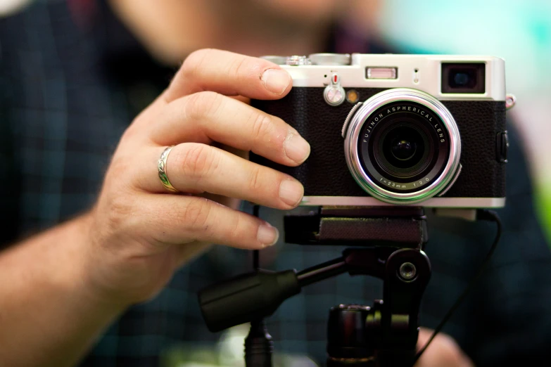 a man holding a camera in his hands