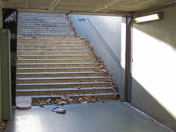 stairs with a broken skateboard leaning against one another