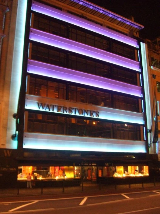 blue lighting is projected on a building at night