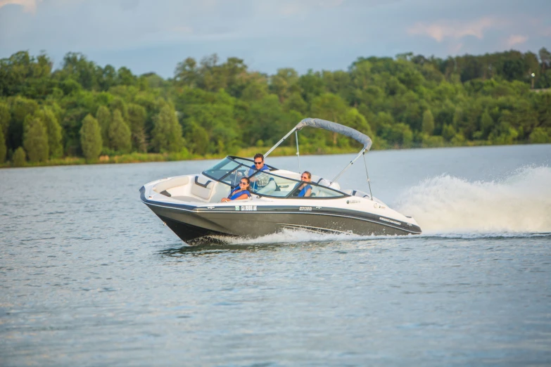 a man in a boat with two people on it