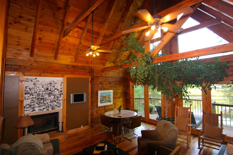 an old cabin with wooden beams and large windows