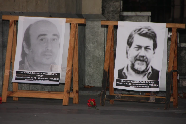 posters showing missing portraits of murdered people