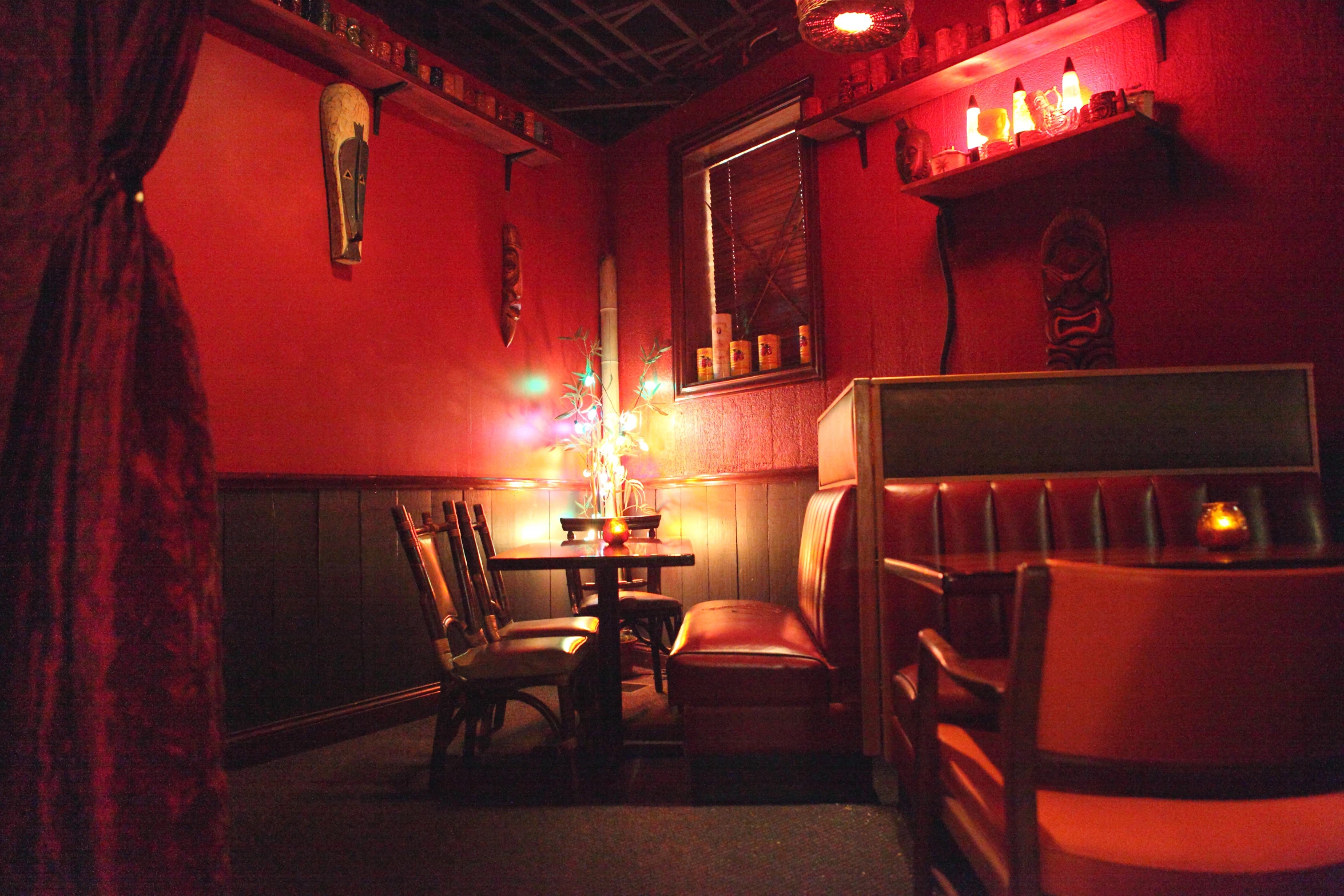 the red room has two tables and chairs