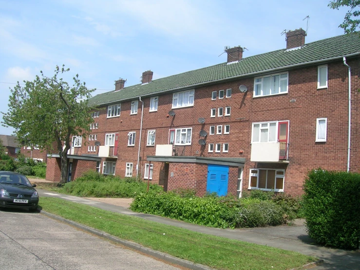a street side view with houses next to each other