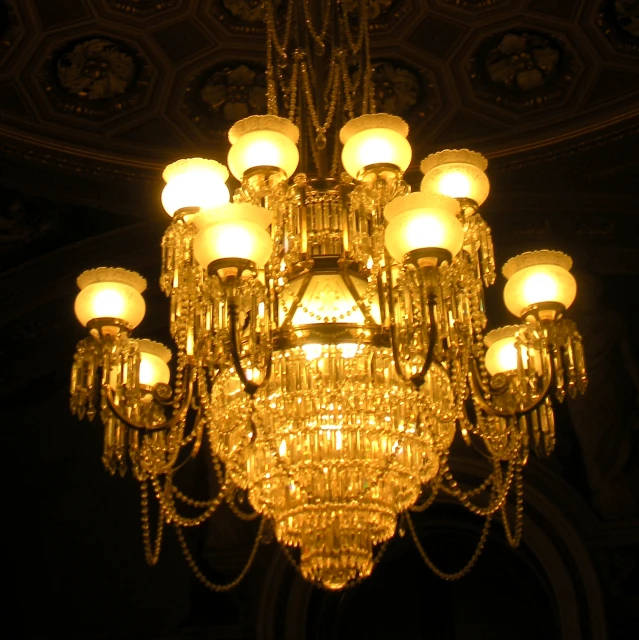 a large chandelier with many lights suspended in the ceiling