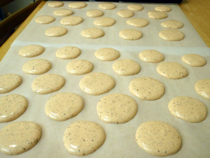 there are cookies on the baking tray and it is white