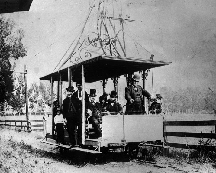 a train car filled with people on top of it