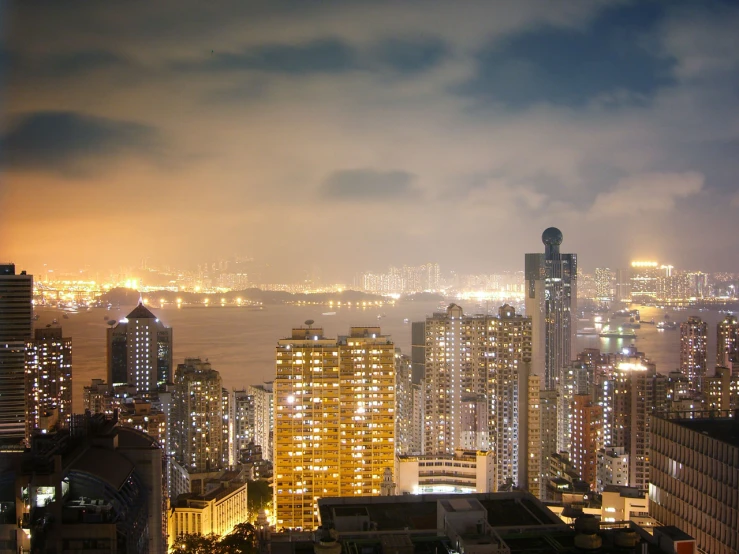 an aerial view of city buildings and its lights at night