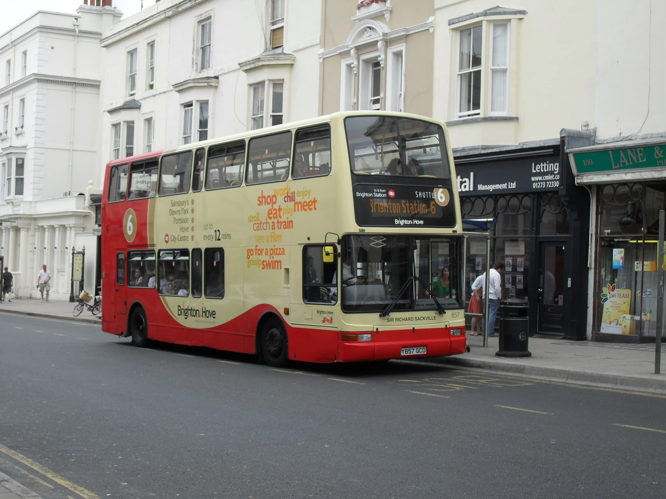 double decker bus with advertits on its side