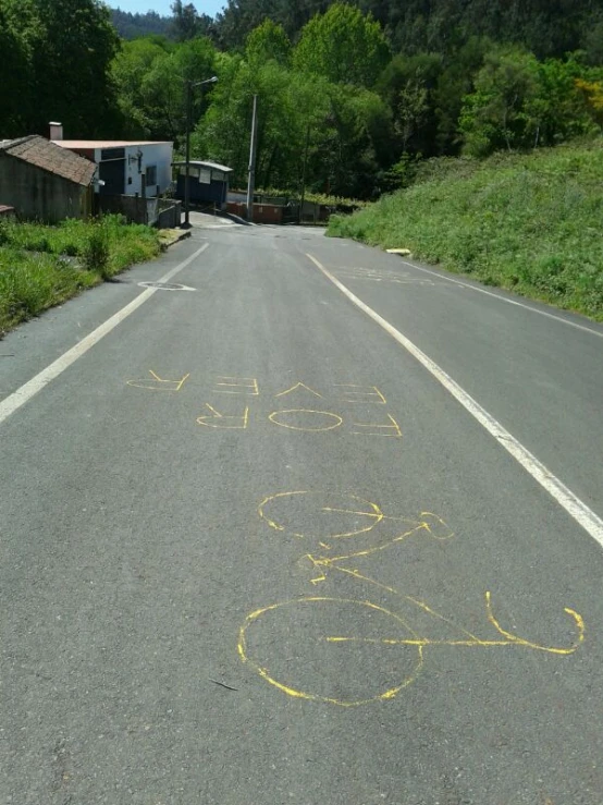 the street is empty with writing on it