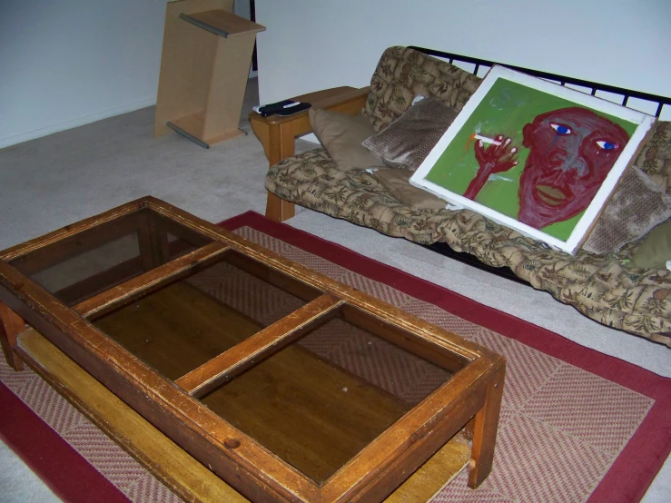 a living room has a glass coffee table and other items