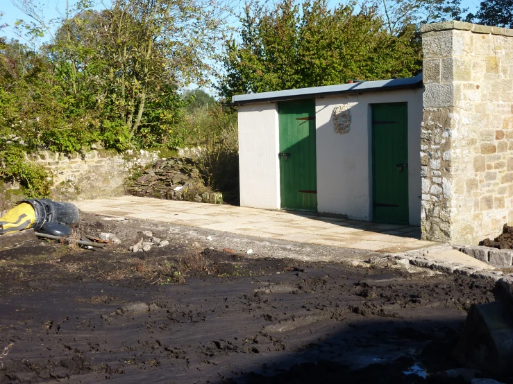 a garage that is being constructed out of rubble