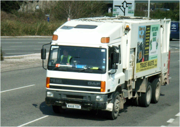 the truck is driving down the empty street