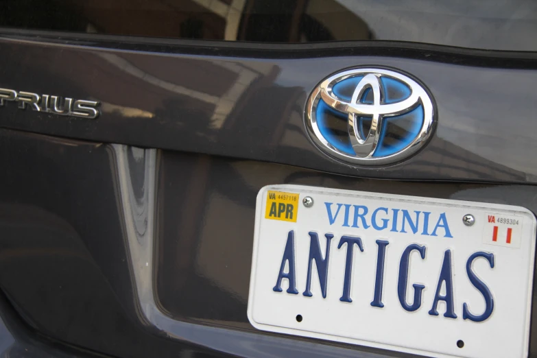 a closeup of a black car with a license plate