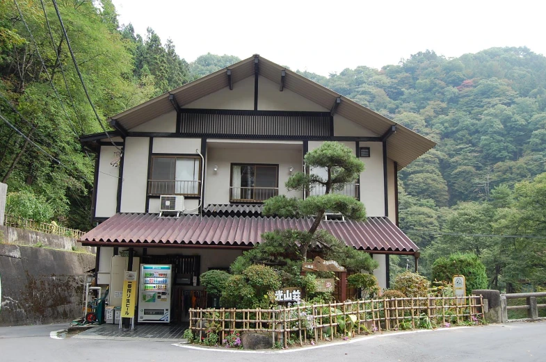 the large white building has wood and tile trim