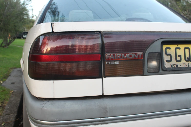 the back of a car parked in front of a house