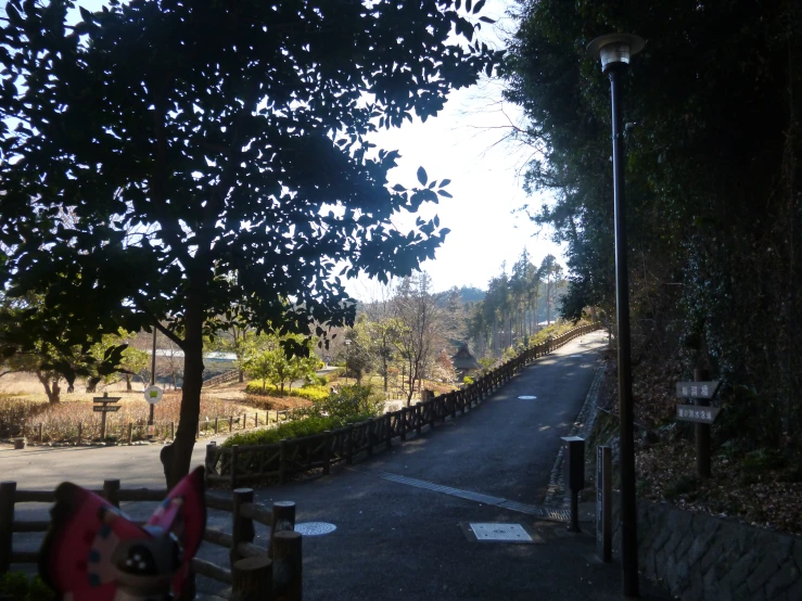 a street that is lined with wooden fences