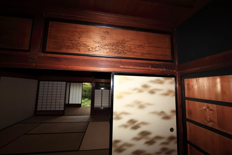 door to a traditional japanese home with wood and tile panels