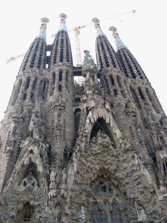 a tall cathedral with sculptures on the front of it