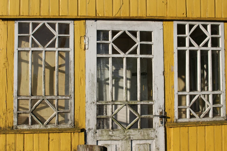 two old windows that are side by side