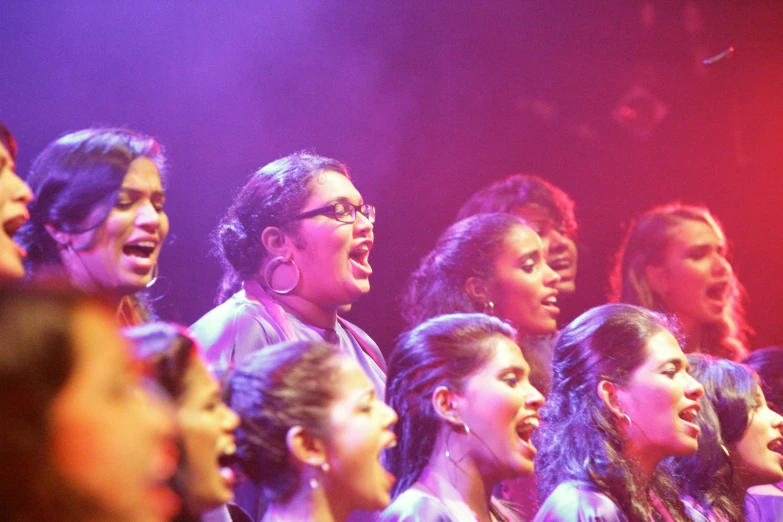 an image of choir singing in a concert