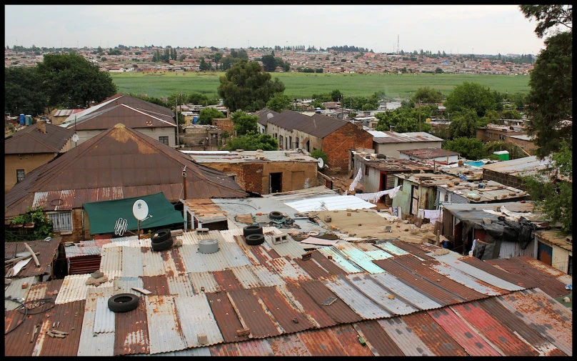 the roof tops of buildings in a village in the countryside