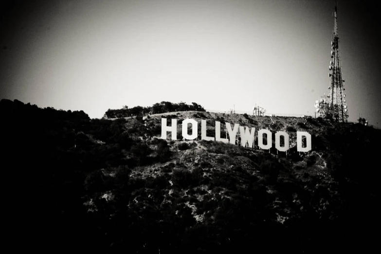 the hollywood sign on a hill against a black sky