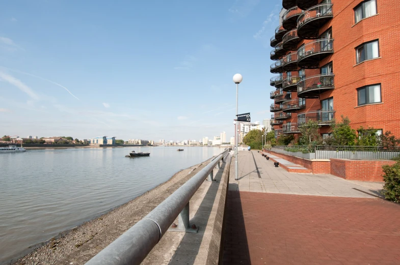 a city sits along the water beside a shoreline