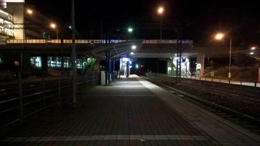 the train track and lights on at night