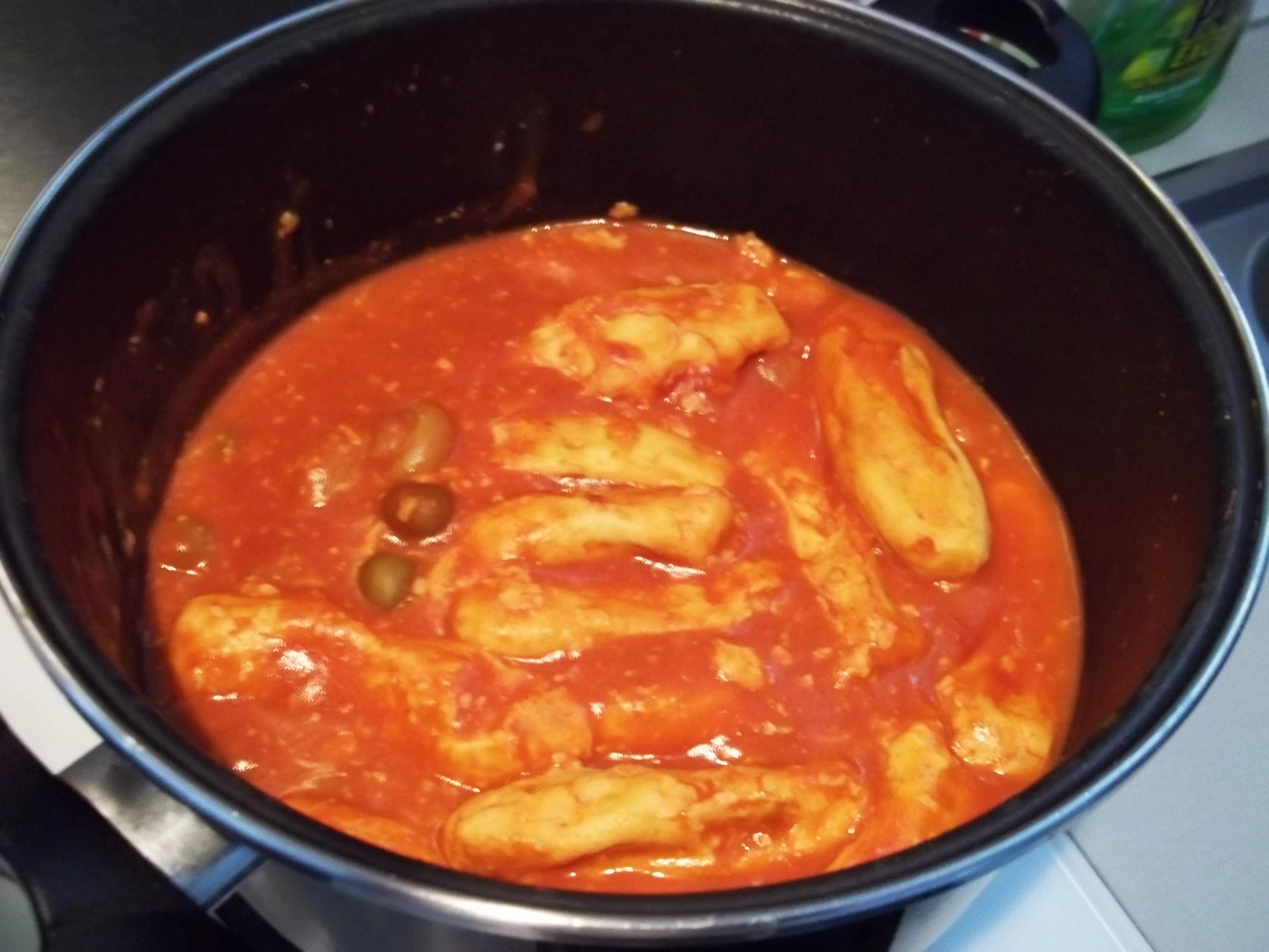 an image of pasta and tomato sauce in a pot