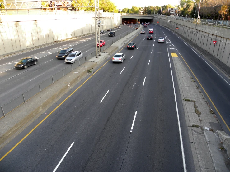 a street with many cars on it and no one driving