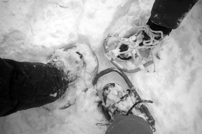 the shoes are in the snow and the snow is everywhere